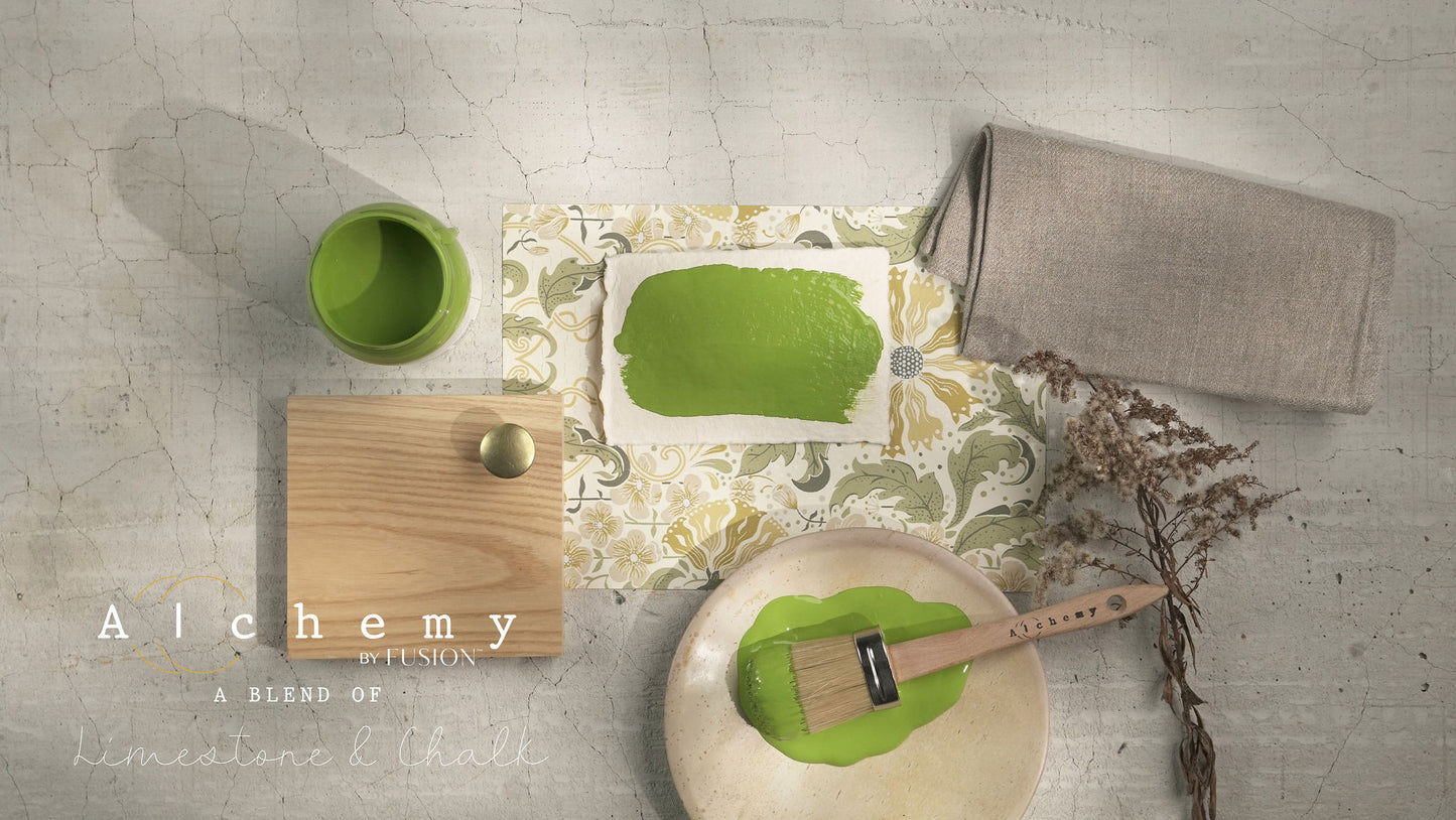 A jar of Alchemy by Fusion chalk paint in a chartreuse color, with a white label.
