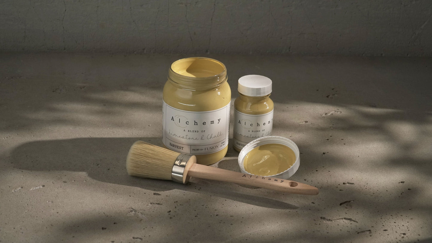 A jar of Alchemy by Fusion Harvest chalk paint in antique yellow color.