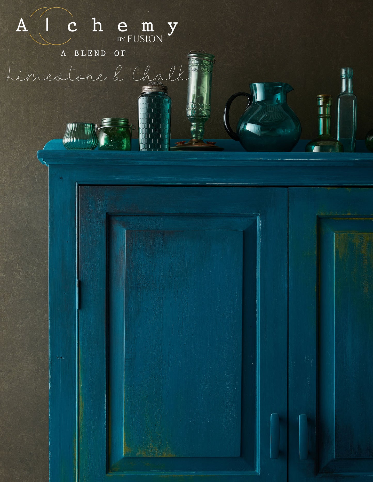 A jar of Alchemy by Fusion chalk paint in a lagoon color, which is a blend of green and blue.