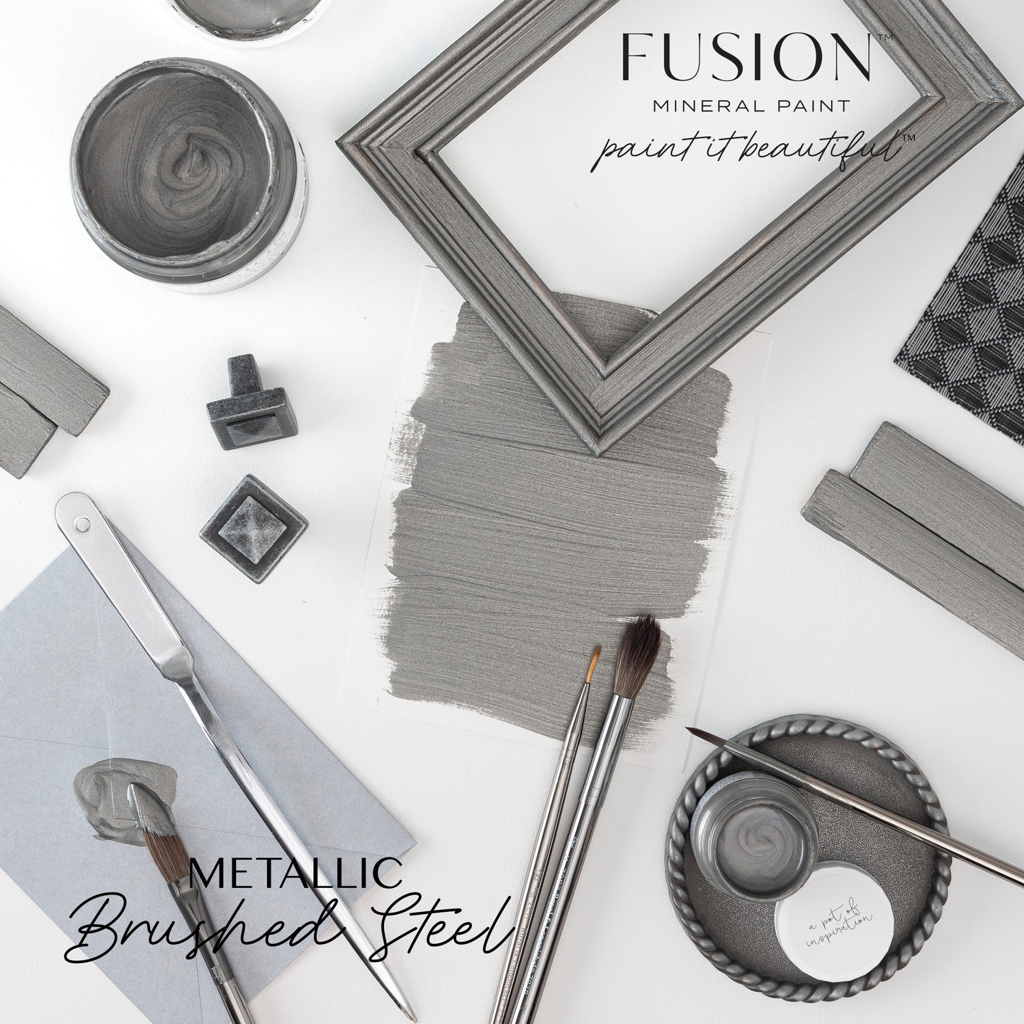 Fusion Mineral Paint display with metallic Brushed Steel color swatches and tools on a white background.