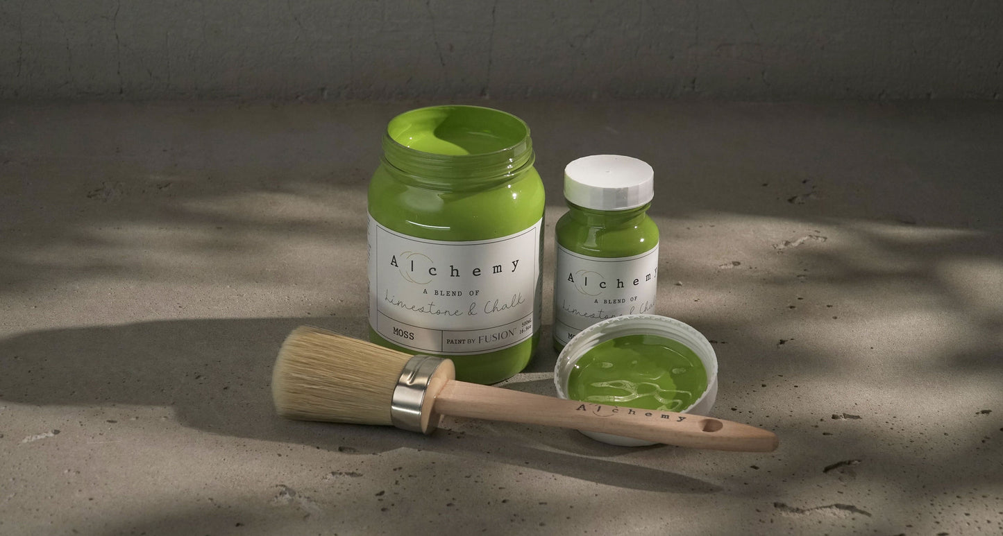 A jar of Alchemy by Fusion chalk paint in a chartreuse color, with a white label.