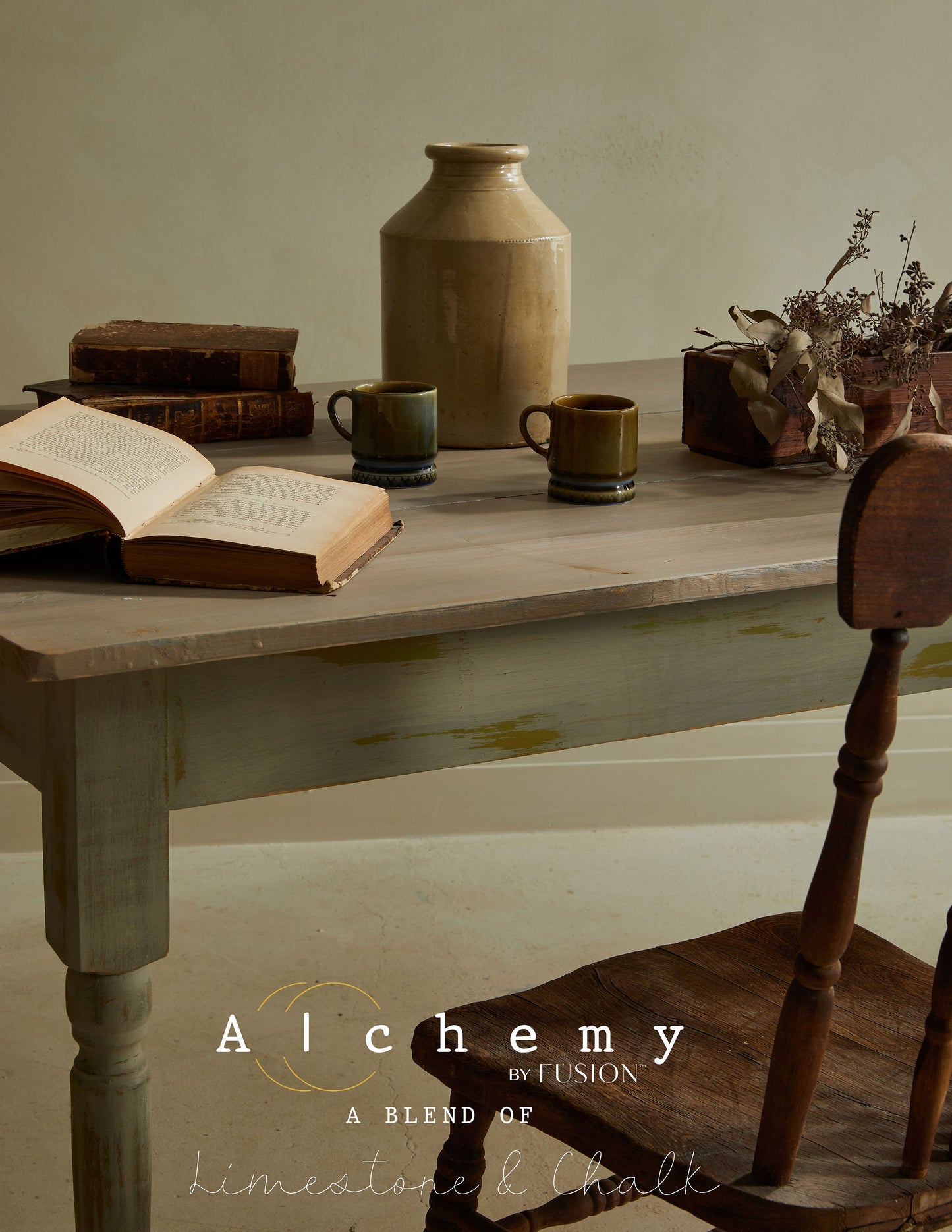 A jar of Alchemy by Fusion chalk paint in a chartreuse color, with a white label.