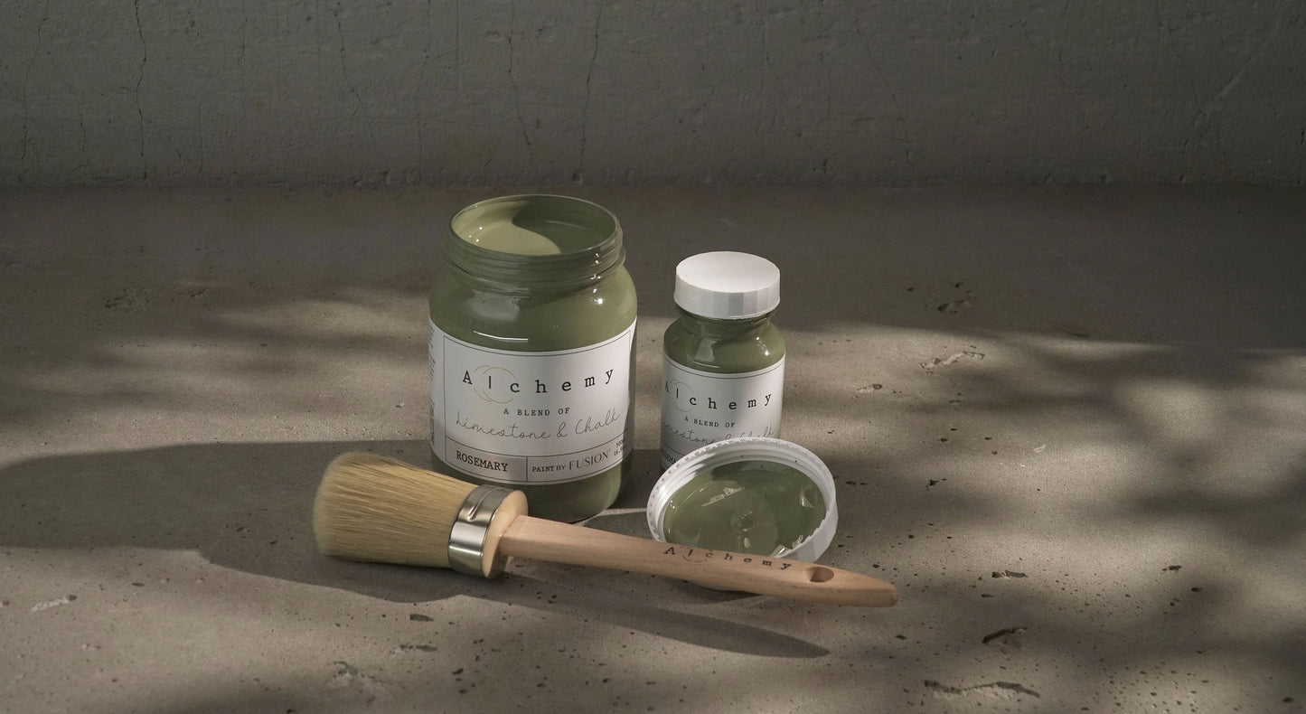 A jar of Alchemy by Fusion chalk paint in a rosemary green color, with a white label on the front.
