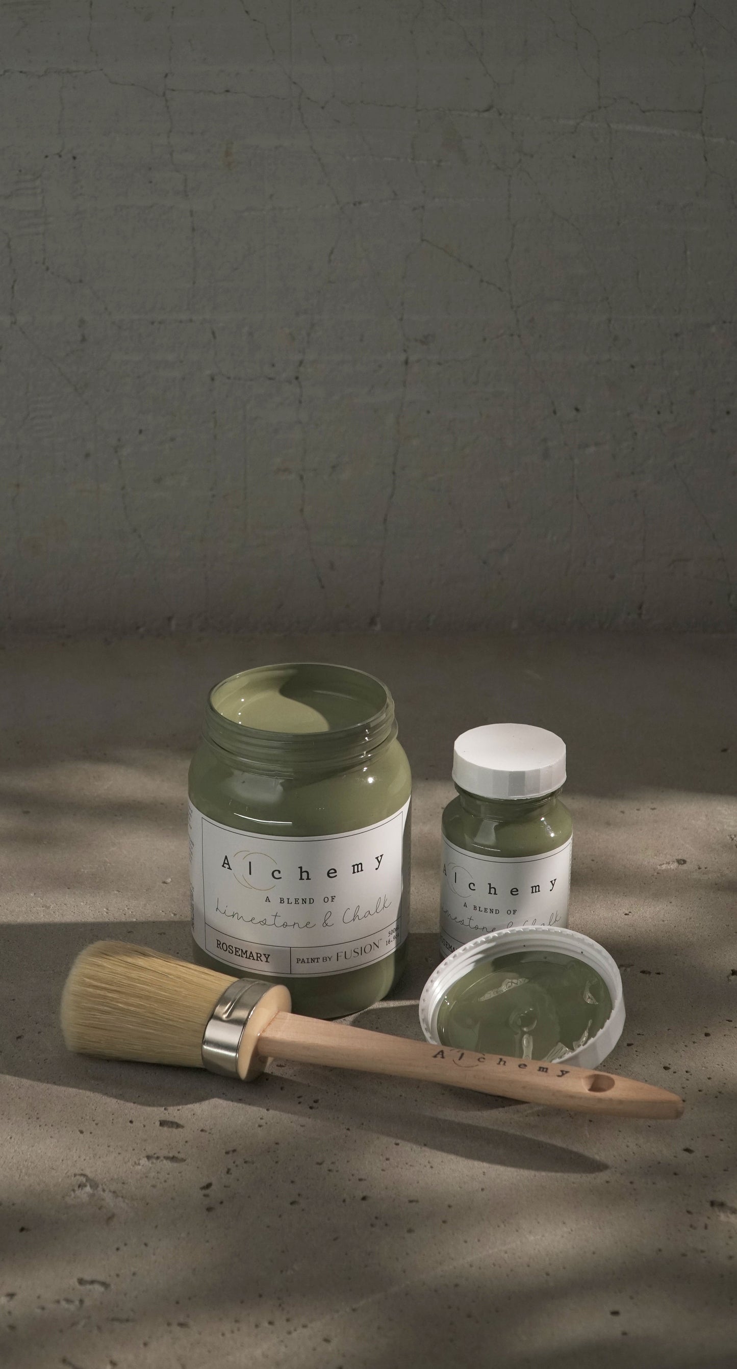 A jar of Alchemy by Fusion chalk paint in a rosemary green color, with a white label on the front.