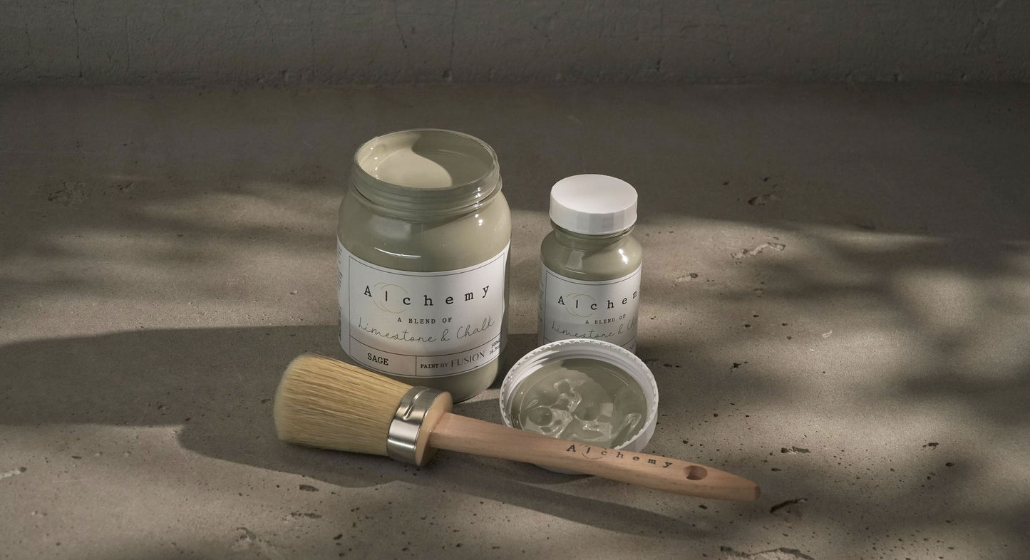 A jar of Alchemy by Fusion chalk paint in sage color, with a white label on the front.