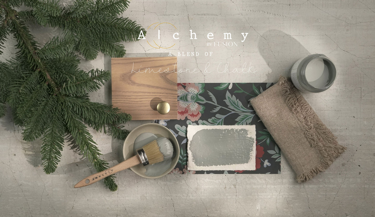 A jar of Alchemy by Fusion chalk paint in a gray color, with a label that includes the product name and the brand's logo.