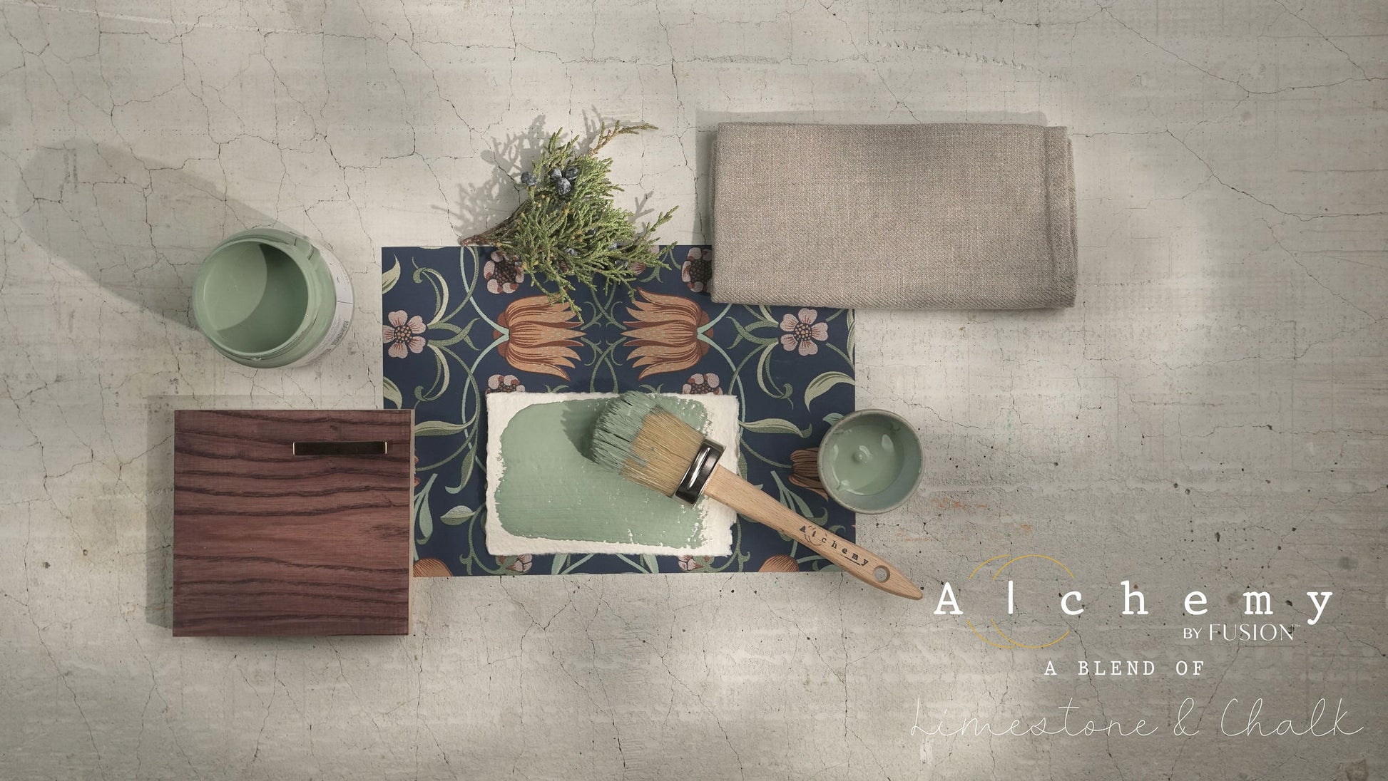 A jar of Alchemy by Fusion chalk paint in a thyme green color, with a white lid and a label that includes the product name and the color 'Thyme'.