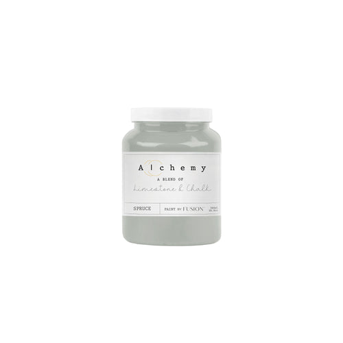 A jar of Alchemy by Fusion chalk paint in a gray color, with a label that includes the product name and the brand's logo.