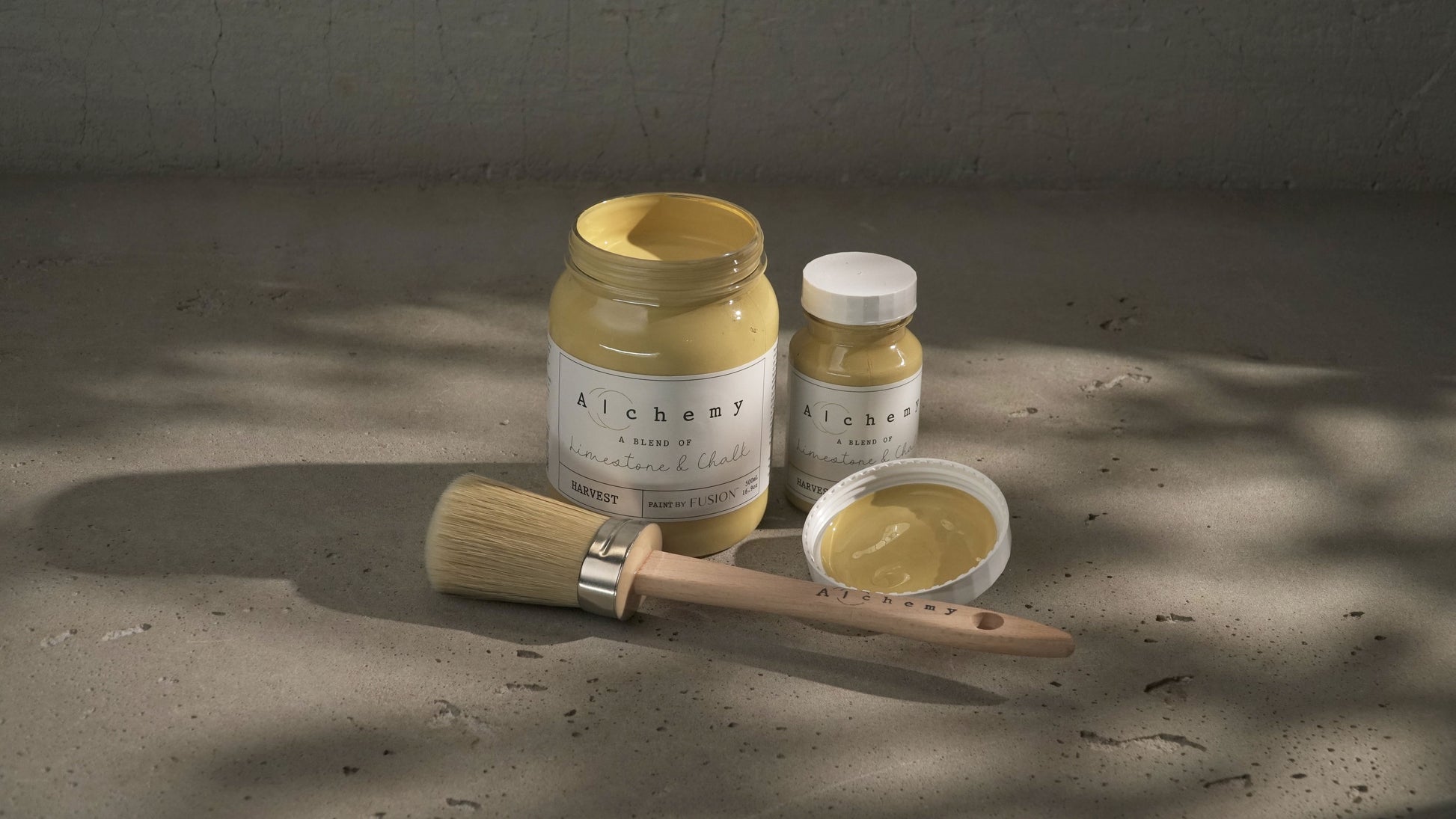 A jar of Alchemy by Fusion Harvest chalk paint in antique yellow color.