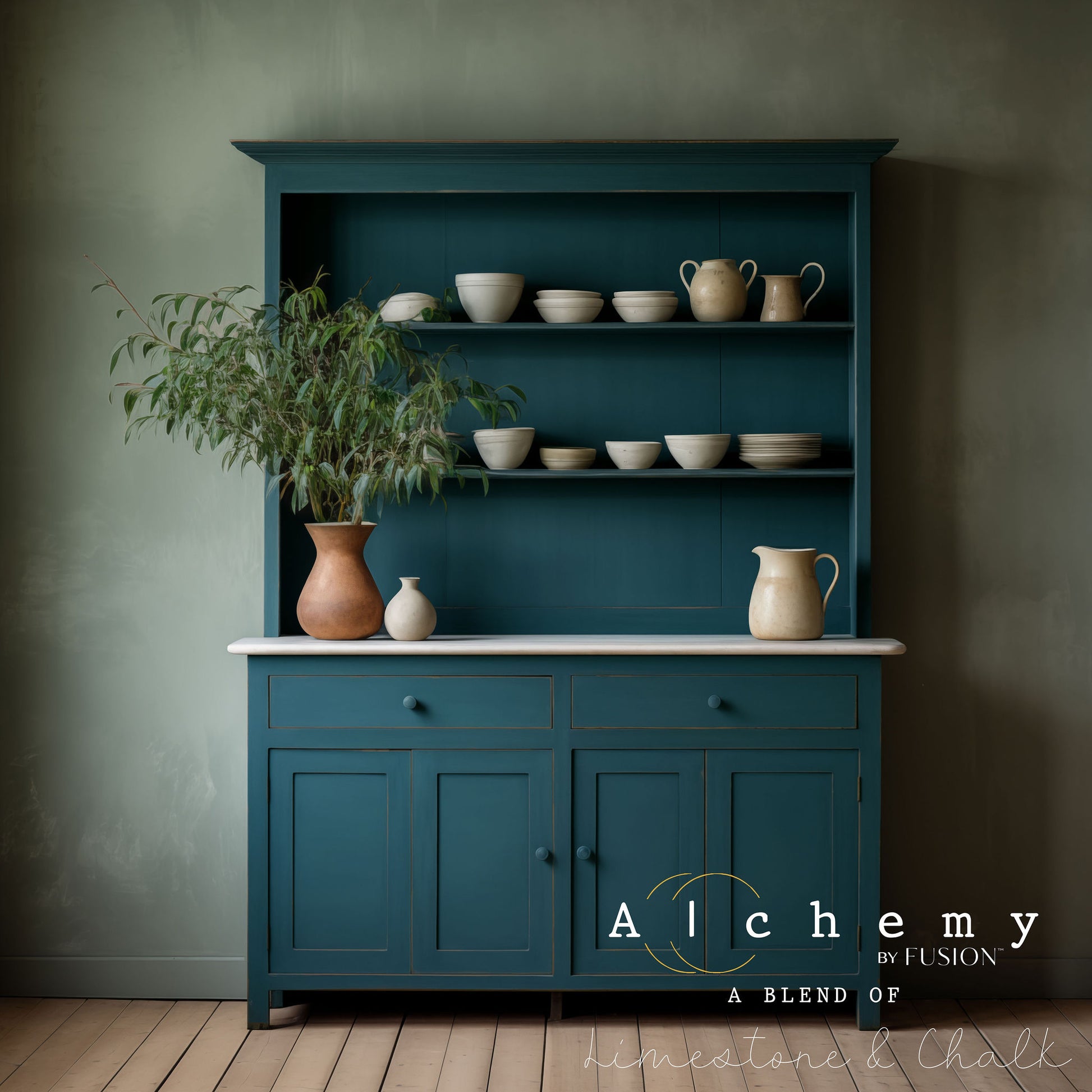 A jar of Alchemy by Fusion chalk paint in a lagoon color, which is a blend of green and blue.