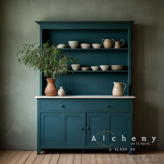 A jar of Alchemy by Fusion chalk paint in a lagoon color, which is a blend of green and blue.