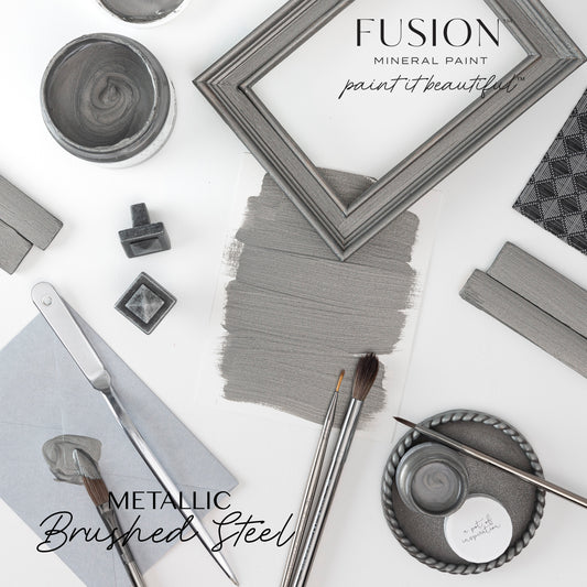 Fusion Mineral Paint display with metallic Brushed Steel color swatches and tools on a white background.