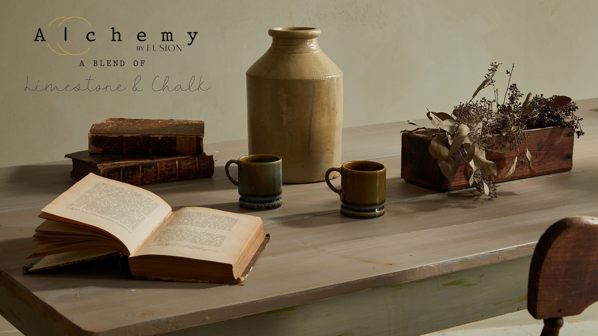 A jar of Alchemy by Fusion chalk paint in sage color, with a white label on the front.