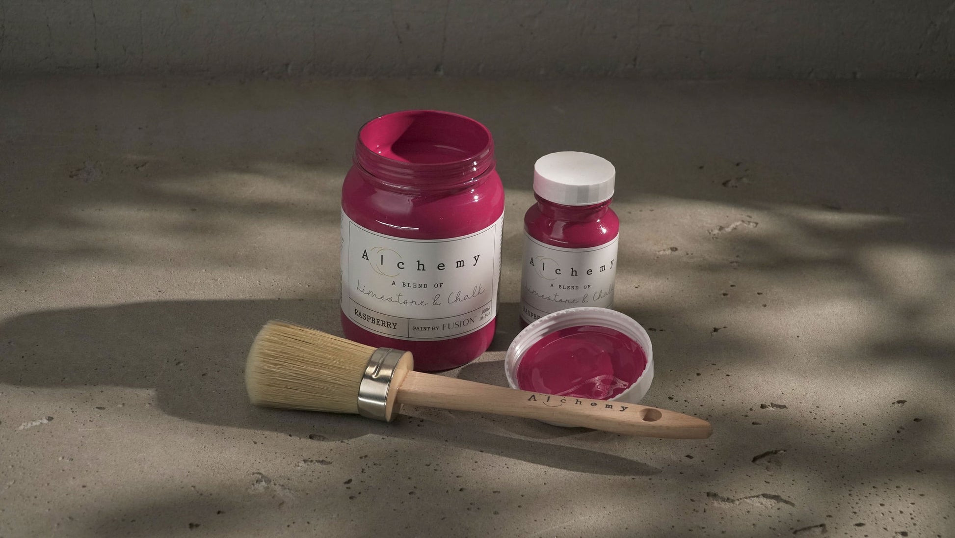 A jar of Alchemy by Fusion chalk paint in Raspberry color.