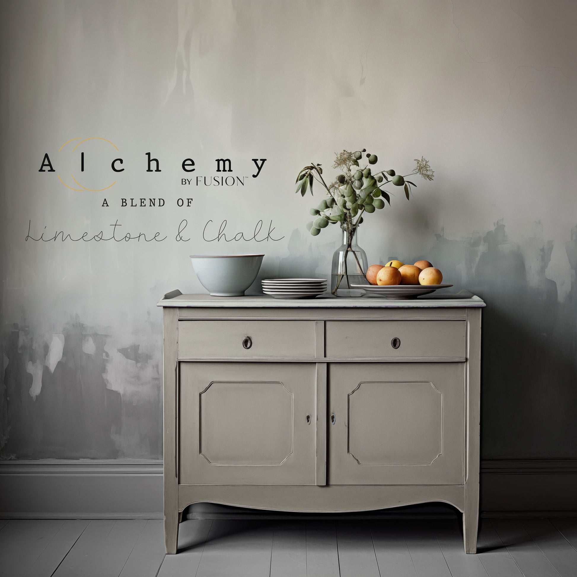 A jar of Alchemy by Fusion chalk paint in a gray color, with a label that includes the product name and the brand's logo.