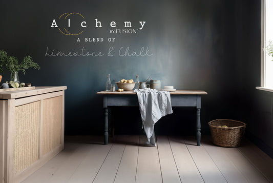 A jar of Alchemy by Fusion chalk paint in a Storm gray color with a lavender undertone.