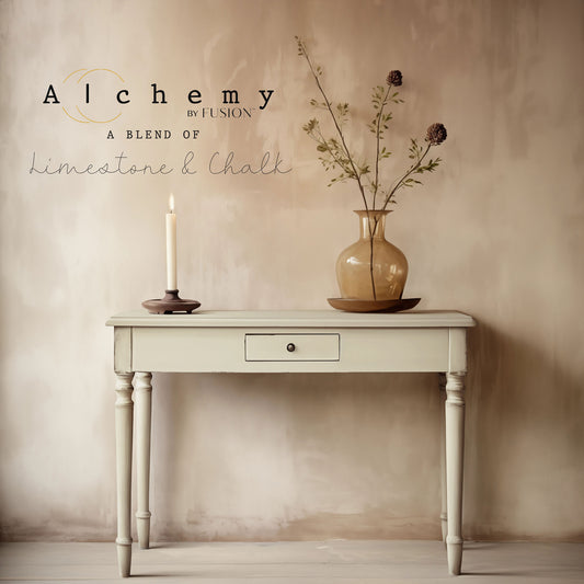A container of Alchemy by Fusion White Oak chalk paint in an off-white color with a label that includes the product name and the words 'a blend of mineral chalk'.