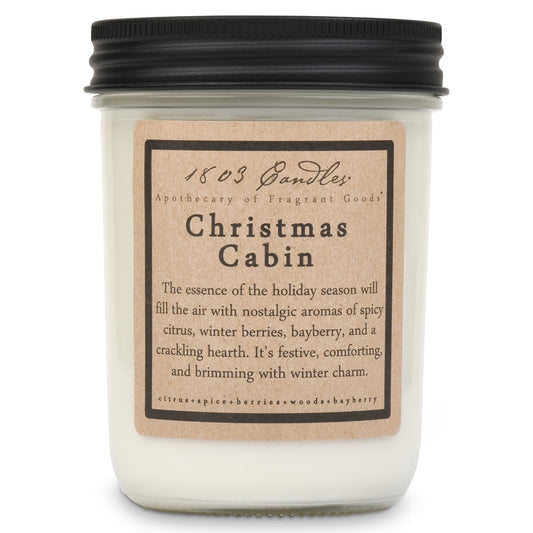 Candle jar labeled 'Christmas Cabin' with a black lid on a white background