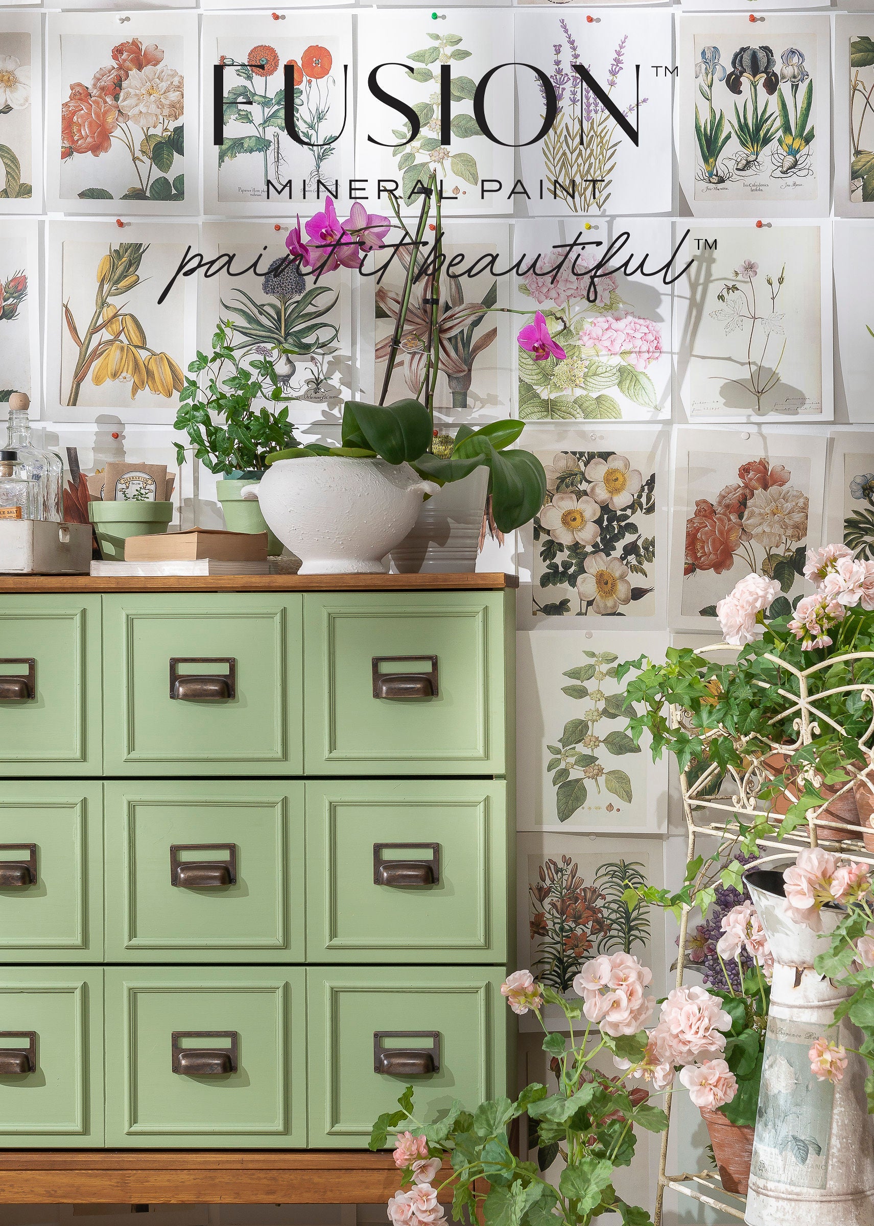 Green cabinet with floral decorations and Fusion Mineral Paint branding.