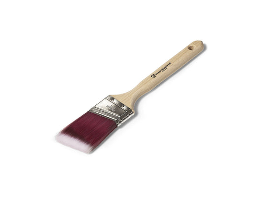 Paint brush with wooden handle and red bristle head on a white background