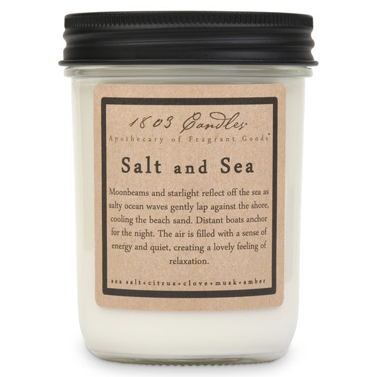 Candle with a label titled 'Salt and Sea' on a white background