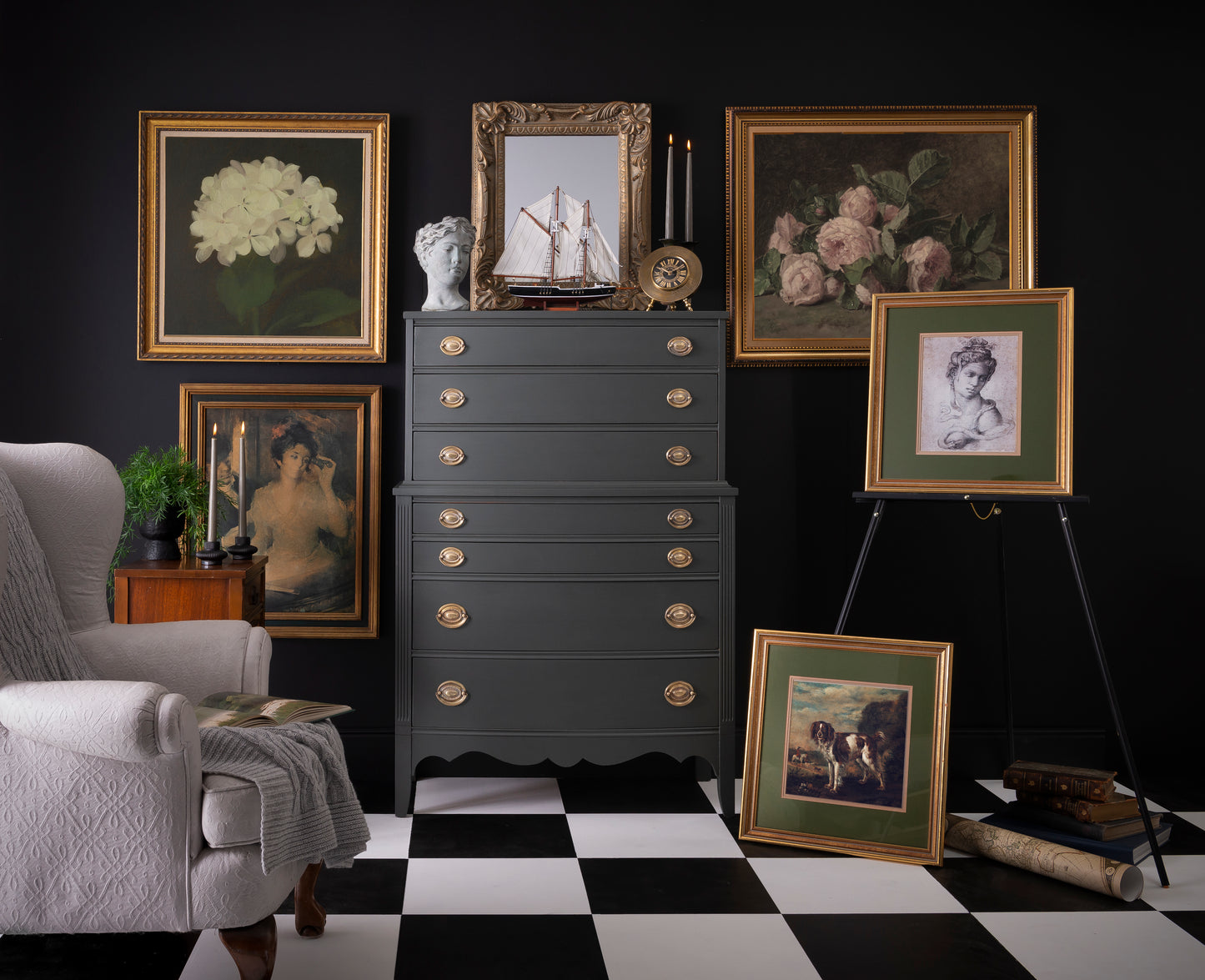 Vintage-style room with dark gray dresser, framed pictures, and a checkered floor.