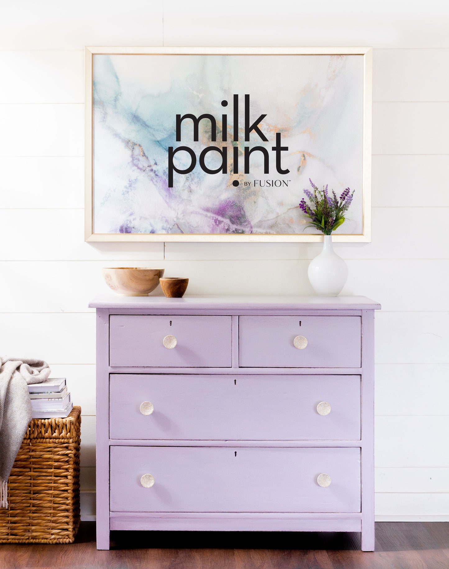 Purple dresser with a 'milk paint' sign in the background